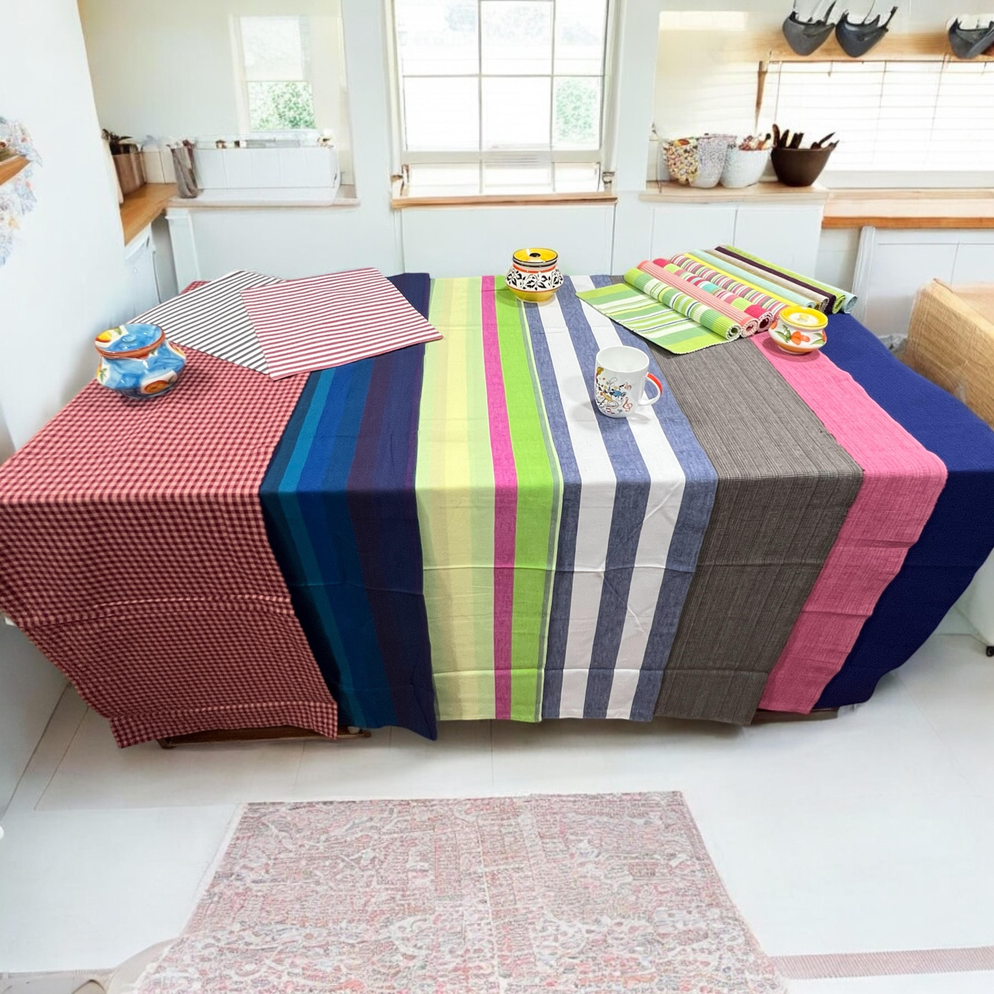 A styled dining table with elegant tablecloths and runners